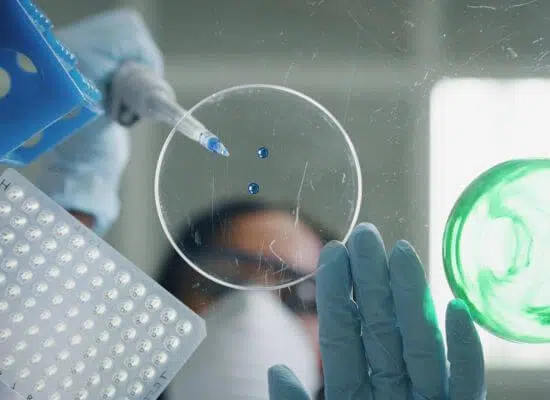 3 Alternative-shot-of-female-scientist-is-analyzing-with-a-pipette-a-liquid-to-extract
